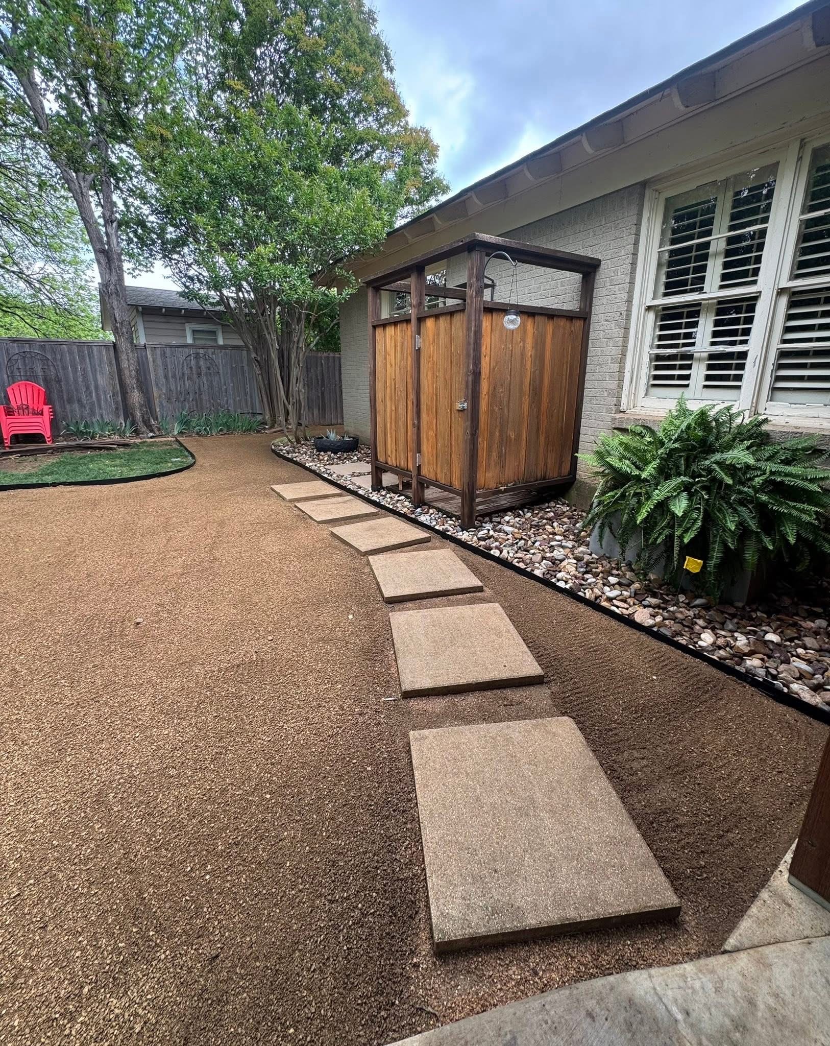 Decomposed granite yard with concrete stepping stone path
